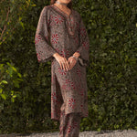 Relaxed yet stylish black kurta set with floral motifs, worn with comfy printed pants and metallic sandals