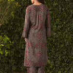 Full back view of the model wearing printed rayon kurta with red floral motifs and box pleat