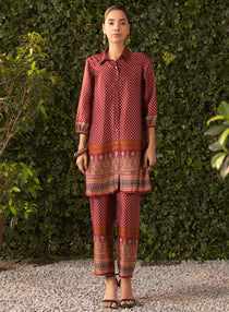 The model is posing with  Lakshitaâ€™s Elisa Maroon Printed Satin Co-ord Set 