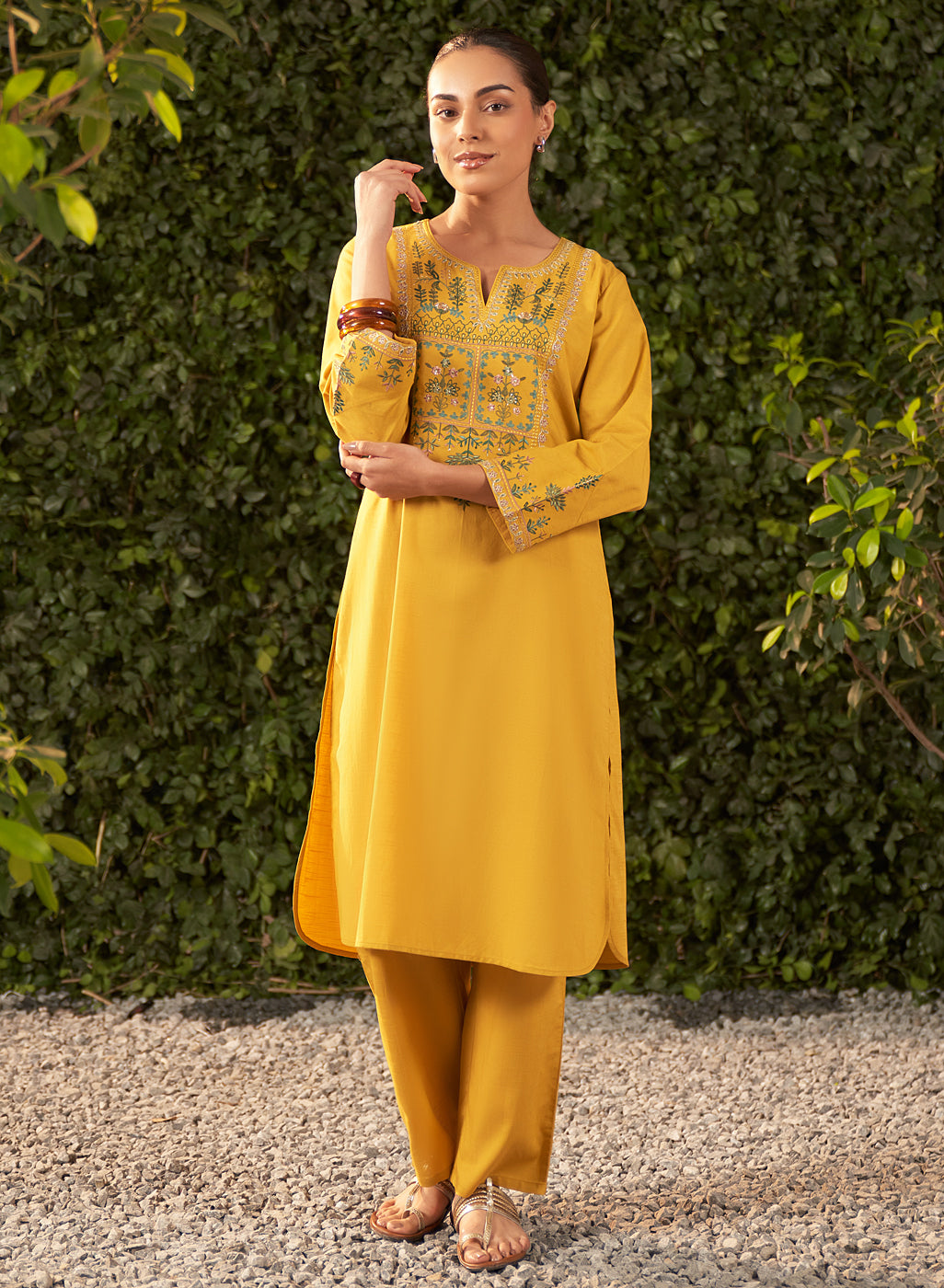 View of Lily yellow embroidered cotton co-ord set highlighting resham, zari, and mukaish work on the kurta's neckline
