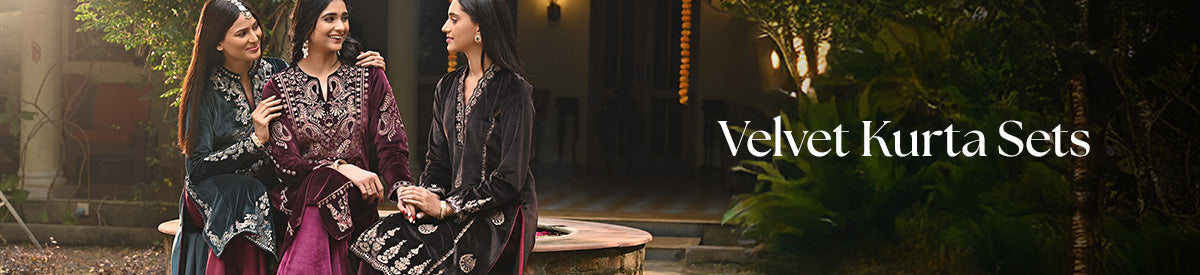 The models with smiling faces are representing Velvet Kurta Sets of Lakshita