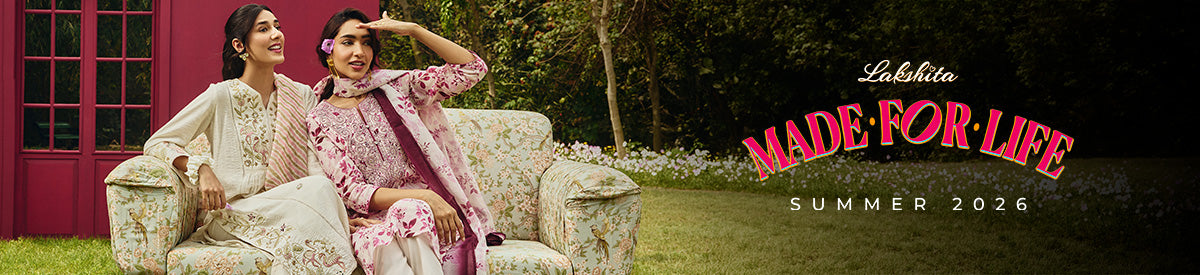 Two women in embroidered purple kurtas sharing a joyful moment while exploring the city – New Arrivals Collection