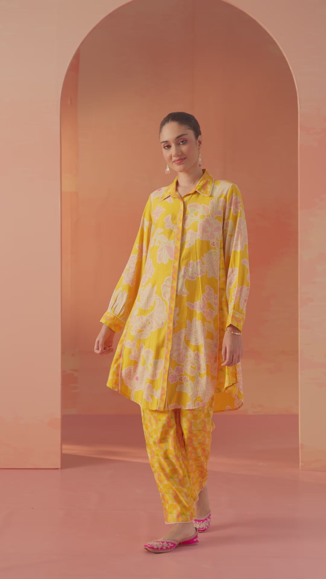 Full-length front view of Seher bright yellow printed Chanderi co-ord set with floral motifs and soft pastel backdrop.