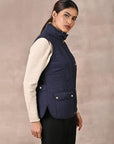 Navy Blue Solid Sleeveless Quilted Jacket With Rivets Detail & Curved Hem - Lakshita