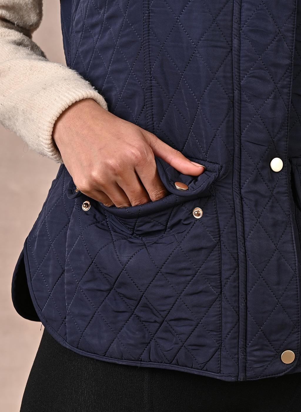 Navy Blue Solid Sleeveless Quilted Jacket With Rivets Detail &amp; Curved Hem - Lakshita