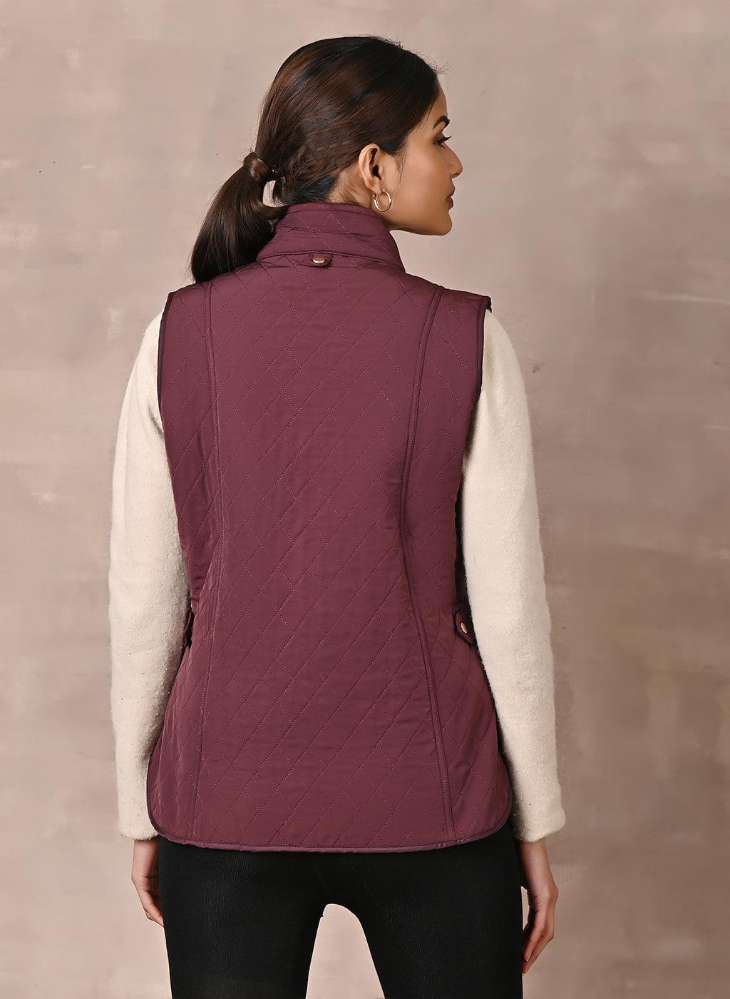 Maroon Solid Sleeveless Quilted Jacket With Rivets Detail &amp; Curved Hem - Lakshita