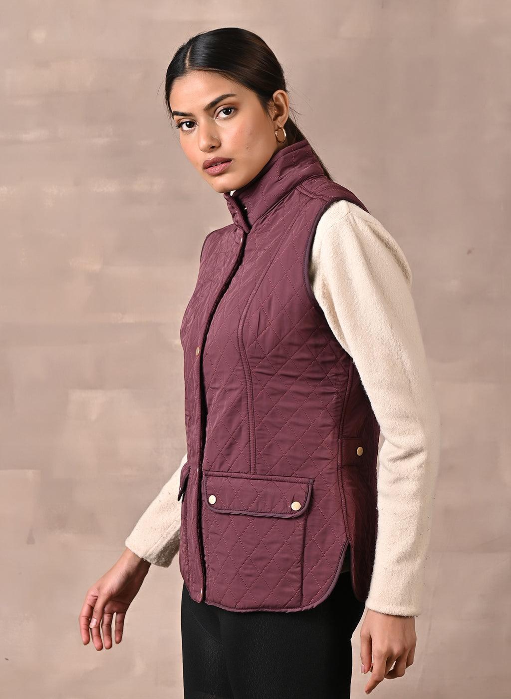 Maroon Solid Sleeveless Quilted Jacket With Rivets Detail &amp; Curved Hem - Lakshita